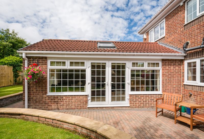 Traditional Sunroom with Brick Base